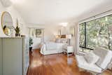 In this bedroom, the natural world is a calming backdrop.