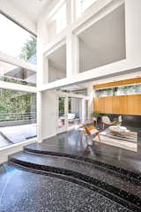 A spacious foyer opens up to a double-height framed view of the Marquam woods at the rear of the home. "Thanks to the strategic placement of windows throughout, including picture windows and high clerestories, you mostly see moss-covered tree trunks, fluttering leaves and branches, and little to no neighbors—making for a quiet, secluded setting," notes the agent.