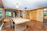 Inside, the home offers a sprawling, open-plan layout. Large windows wrap around the dining room which is located just steps from the kitchen.  Photo 4 of 11 in Asking $675K, This Eccentric Connecticut Midcentury Is a World Unto Its Own