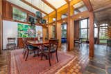 A more formal dining area sits adjacent to the lower level's Great Room, allowing for easy entertaining. Original slate and brick line the floors.  Photo 6 of 11 in Asking $675K, This Eccentric Connecticut Midcentury Is a World Unto Its Own