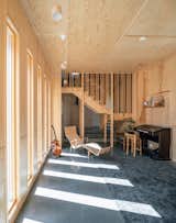 The kids like to play on the wooden staircase and in the nooks around it, one of which sometimes also serves as an ad hoc laundry chute.