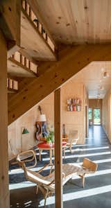 Architect Pernilla Wåhlin Norén designed an L-shaped home for her family in Borlange, Sweden. The perpendicular volumes are connected by a pine-shingled section. Plywood interiors complement vintage Alvar Aalto furniture handed down by a relative who worked at an Artek factory nearby.  Photo 2 of 11 in A Swedish Architect Crafts a Flexible Home Fine-Tuned for Her Musical Family