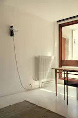 The dining table is by Rafael, and the chairs are by Philippe Starck.