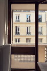 The apartment is located in a 1960s building in the 11th arrondissement, a varied, buzzy area full of boutiques, restaurants, and nightspots.  Photo 1 of 11 in Rafael de Cárdenas Opens Up His Un-Parisian Paris Pied-à-Terre