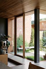 Chris made a point of avoiding plasterboard, instead using structurally insulated panels for the walls to create an airtight seal, and for the flooring, a hydronic concrete slab from Hydrotherm that can warm or cool the interiors.  Photo 13 of 59 in windows by Kathleen Winter from A Trio of Design Professionals Create a Development of High-Performing Townhouses in Melbourne