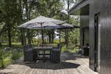 A large deck extends the living area outdoors, providing an idyllic spot for al fresco dining.