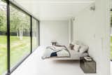 Keep it light and airy in the bedroom—and make sure to vacuum under the bed. 