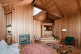 Just inside the home’s entry, steps lead down to a cozy living area.