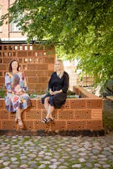 Elina Koivisto and Maiju Suomi pose with the parklet they designed in Helsinki, the Alusta Pavilion, which opened in June of this year.