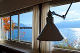 A band of windows, also shot by Jürg Gasser, looks out onto Lake Geneva and the Savoy Alps.