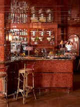 Burl wood veneer panels wrap the walls of the on-site restaurant, Ash Bar.  Photo 6 of 7 in Baltimore’s New Ulysses Hotel Channels the Kaleidoscopic Ouevre of Filmmaker John Waters