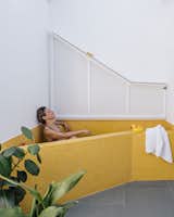  Photo 8 of 21 in This 506-Square-Foot Apartment Lives Large With Cheery Yellow Interiors and an Outdoor Soaking Tub
