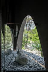 On the ground level, one of the home’s massive cutouts creates a connection with the outdoors.  Photo 3 of 8 in Pritzker Prize Winner Alejandro Aravena Is Raffling Off His Latest Home for Charity