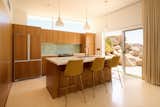 The cabinetry in the kitchen is walnut siding that has been bleached over time by the sun. &nbsp;