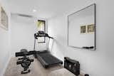 In addition to three airy bedrooms and an office space, the home also includes a gym.
