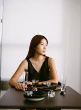 Designer Jialun Xiong sits at her pared-down, intentional, table for two.&nbsp;