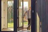 A Level Touch and Level Keypad were incorporated on the mudroom entryway  Photo 12 of 13 in This Charming Kalamazoo Farmhouse Has a High-Tech Secret