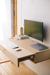 As part of their space-saving design, the duo created a floating desk. Its plans are available at their website.