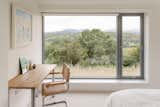 Each of the four bedrooms features a large expanse of glazing that frames picturesque views of the wide-open countryside.