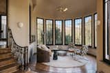 Tall windows invite warm natural light into one of the many octagonal sitting areas.