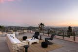 An expansive roof terrace captures panoramic views of downtown L.A. and the surrounding landscape.