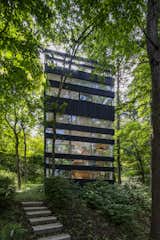 Dubbed the Ring House, the multilevel property looks like a mini skyscraper nestled in a remote forest.