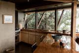 Tree house vibes await in the warm, timber-framed kitchen, complete with new appliances.&nbsp;