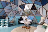 Numerous triangular skylights dot the exterior of the geodesic dome.
