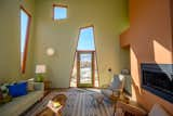 Throughout the residence, trapezoidal windows and doors frame the dramatic desert landscape.  Photo 3 of 7 in One Night in Joshua Tree’s Multicolored, Cubist Monument House