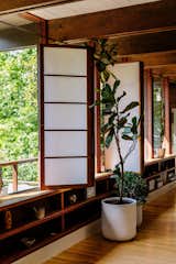 The original owners made the shoji panels themselves, and John and Erik replaced the rice paper. “There’s something special about knowing the screens were made by hand,” Erik says.  Photo 6 of 33 in Open rafters by Glassenstump Creations from An Artful Restoration Returns a Louisville Home to Its Midcentury Roots