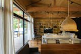 The sophisticated interiors belie the fact that the house is almost entirely off-grid. The water, sanitary, and heating systems are completely independent, and the electrical system is connected to the grid only as a backup. The house relies mainly on solar panels and a generator for power.  Photo 9 of 13 in One of Argentina’s First Passive Houses Stands Tall Above Rising Tides