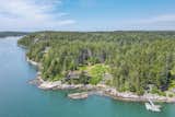 Surrounded by conserved land, the property includes a small island, a private pocket beach, and access to a shared deepwater dock in Murch’s Cove.&nbsp;