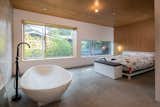 A freestanding tub in the bedroom is a little touch of hotel luxury.