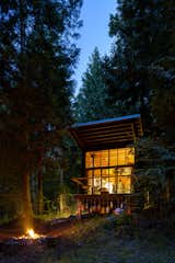 At night, full-height glazing makes the cabin glows from within.