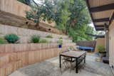 In addition to a large patio and skate ramp, the tiered backyard also features a treehouse.