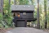 The black-painted exterior gives the cabin a contemporary look—all the way down to the lower-level garage and basement.