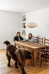 In the dining area, a Noguchi Akari 21A pendant hangs above chairs and a table found at a thrift store.