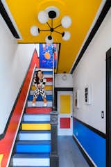 By coincidence, the stairs leading up to Lizzy’s apartment were already painted in bright colors, but they serve as an excellent lead-in to the magic that lies beyond. "I’m an aggressive colorist," she says.