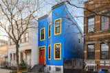 The bright-blue exterior of Brooklyn artist Lizzy Plapinger’s apartment is the icing on the confetti cake that is her home. Formerly of the band MS MR, the solo indie musician, who performs as LPX, and cofounder of record label Neon Gold, repaints used furniture, such as the decorative piece in her kitchen, in her "signature Pantone-punk style."