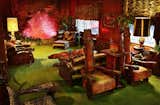 Graceland’s Jungle Room has Polynesian-inspired furniture with carved wood details, faux fur upholstery, and green shag carpet on both the floor and the ceiling.&nbsp;