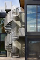 A stainless steel spiral staircase connects the pool level to the roof deck where the homeowners can reminisce about the cloud forests of Ecuador.