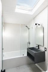 The home’s two bathrooms have been updated with sleek contemporary finishes.