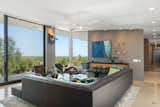 Floor-to-ceiling windows continue into the living room, where a Malm woodburning fireplace awaits. A media room and office can be found just down the hall.