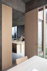 Bruno transformed the building’s ground-floor bakery into an office for his eponymous firm.  Photo 15 of 75 in Plywood by Thomas Albrecht from In Brussels, an Architect’s Copper-Clad House Makes Brutalism Warm
