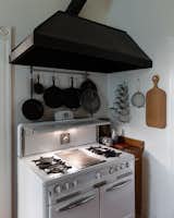 In addition to a central island, the revamped kitchen also has a vintage Wedgewood stove.