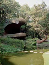 El Nido de Quetzalcóatl (or Quetzalcóatl’s Nest) is one of Mexican architect Javier Senosiain’s most representative works of organic architecture.&nbsp;The undulating structure makes use of the natural caves and curves of the terrain and was designed to look like a slithering serpent.