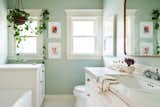 The soothing green primary bath features all new fixtures and a large bathtub.