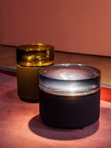 Side tables traditionally serve a function, but as far as I’m concerned, all that Draga & Aurel’s drums need to do is sit pretty. Thick slabs of resin that look more like jello are layered atop a reflective metal surface.