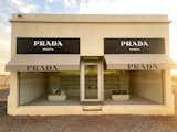 Prada Marfa is a permanent, site-specific installation by artists Elmgreen &amp; Dragset located on a barren stretch of highway one mile west of Valentine, Texas.