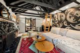 Despite the home's 571-square-foot layout, the interior feels extra spacious thanks to the tall, vaulted ceilings.